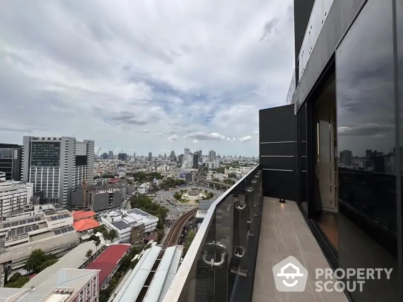 Stunning cityscape view from modern high-rise balcony, perfect for urban living.