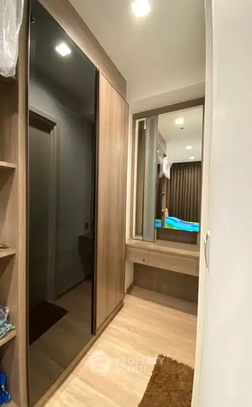 Modern bedroom with sleek wardrobe and cozy lighting