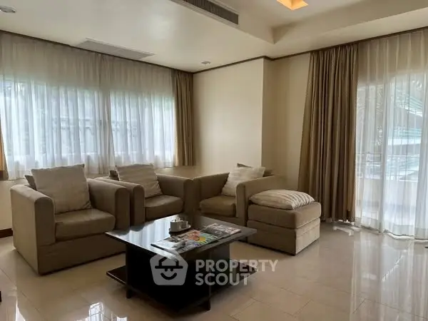 Spacious living room with cozy seating and natural light