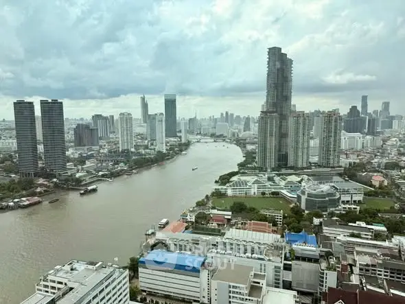 Stunning cityscape view with river and skyscrapers, perfect for urban living enthusiasts.
