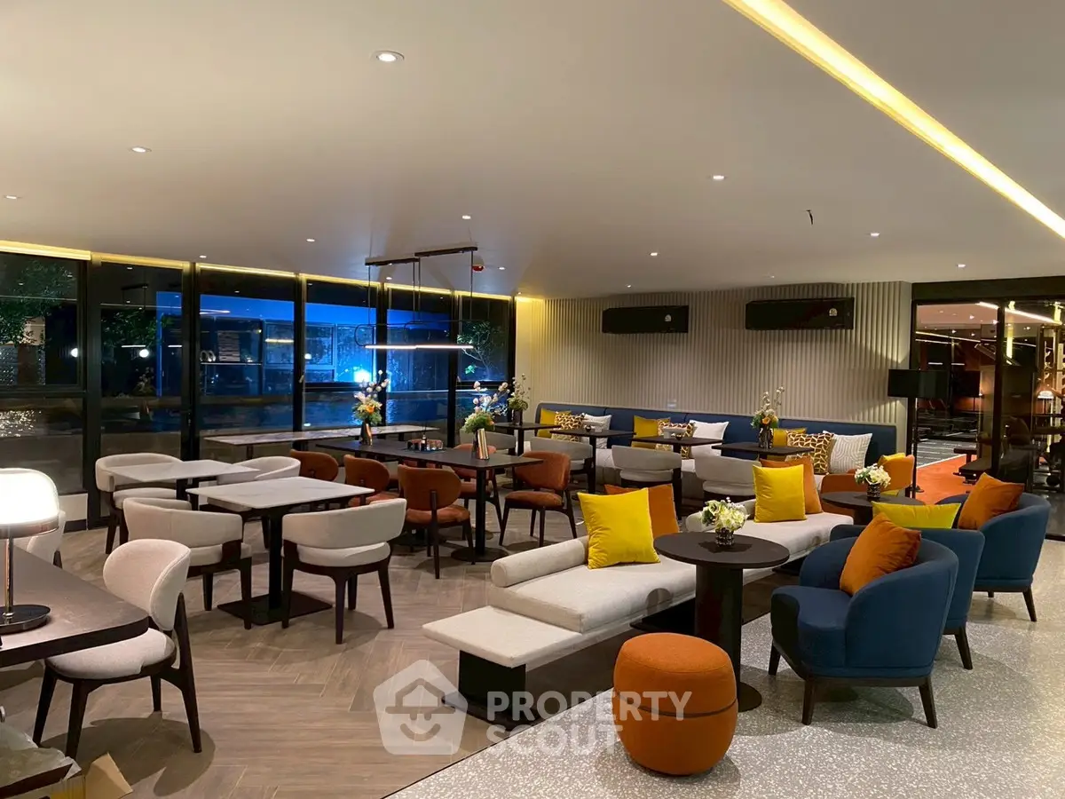 Luxurious modern lounge area with stylish seating and ambient lighting, perfect for relaxation and social gatherings.