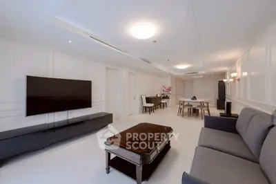 Spacious modern living room with elegant decor and large TV