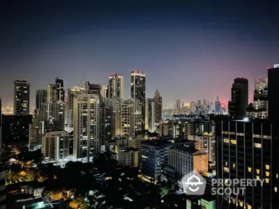 Stunning night view of a vibrant city skyline with illuminated skyscrapers.