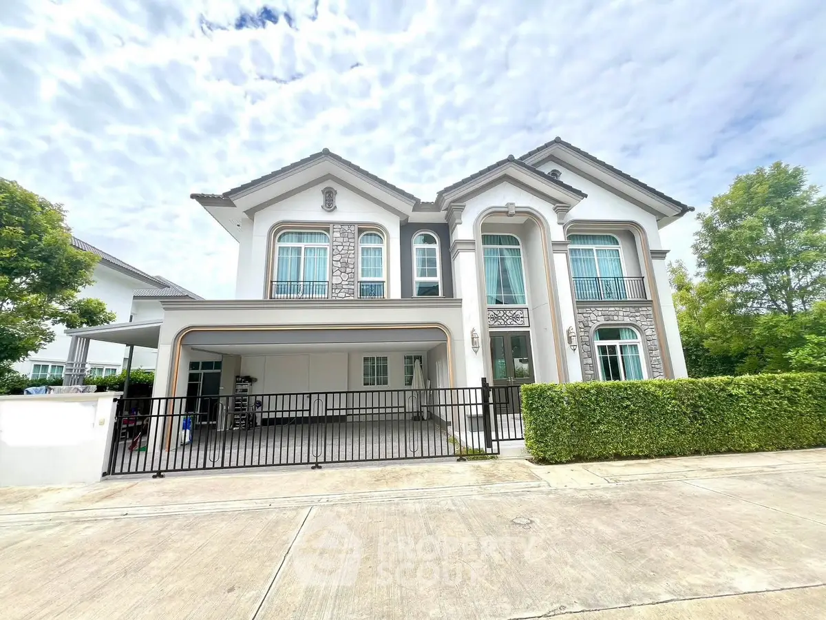 Elegant two-story house with modern architecture and lush greenery, perfect for family living.