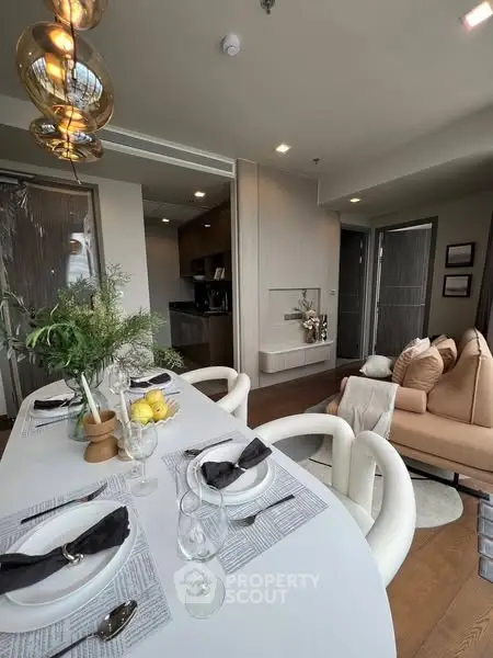 Elegant dining area with modern decor and cozy seating in a stylish apartment.