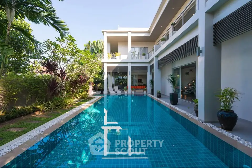 Luxurious modern villa with private pool and lush garden, perfect for serene living.