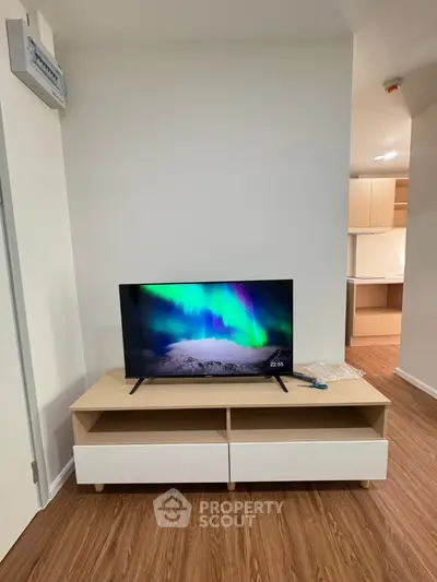 Modern living room with sleek TV stand and vibrant screen display