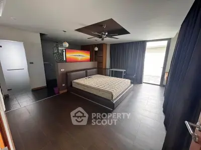 Spacious modern bedroom with large windows and stylish decor