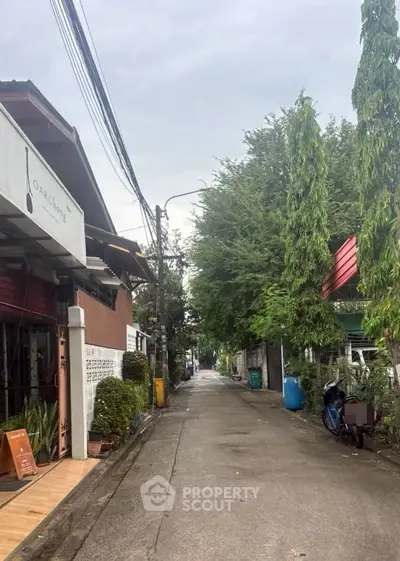 Charming residential street with lush greenery and cozy homes, perfect for tranquil living.