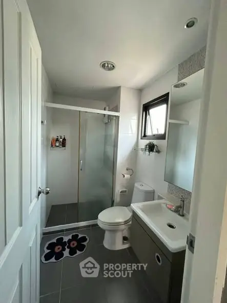 Modern bathroom with glass shower and sleek fixtures