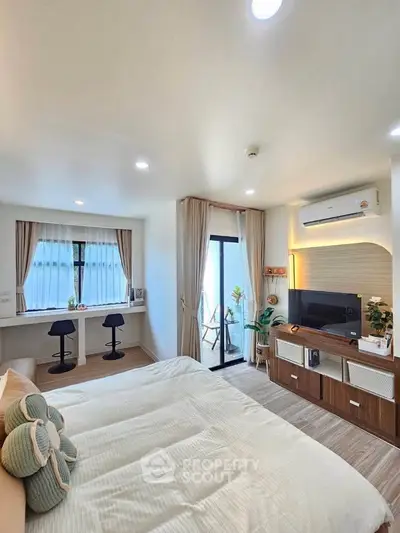 Modern bedroom with balcony access and stylish decor