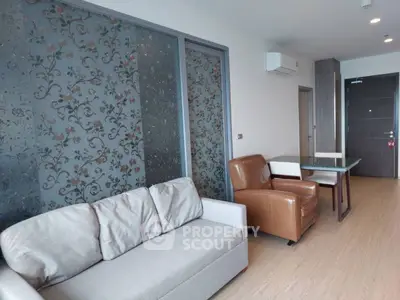 Modern living room with stylish furniture and floral accent wall