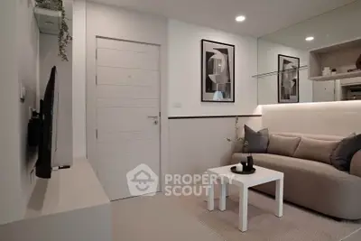 Modern living room with sleek design and cozy sofa in stylish apartment.