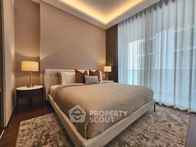 Luxurious bedroom with elegant decor and large windows for natural light.