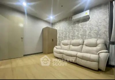 Modern living room with stylish wallpaper and comfortable sofa