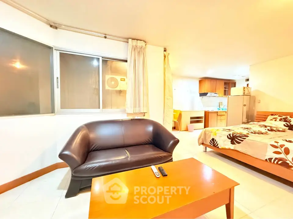 Cozy studio apartment with modern furnishings and open layout in a vibrant urban setting.