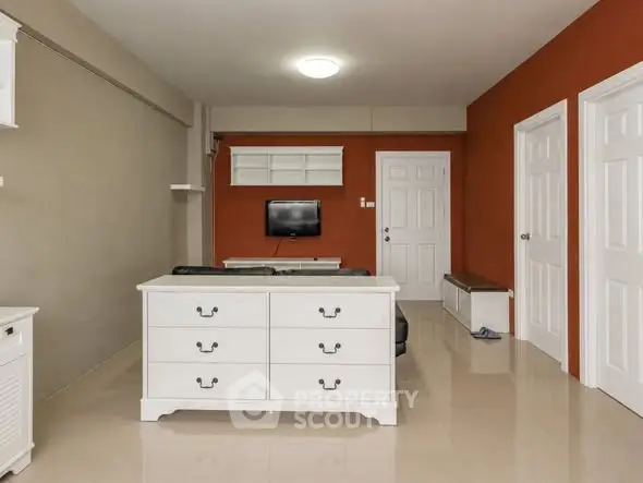 Modern living room with sleek furniture and neutral tones, perfect for relaxation and entertainment.