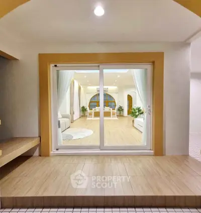 Spacious living room with sliding glass doors and modern decor