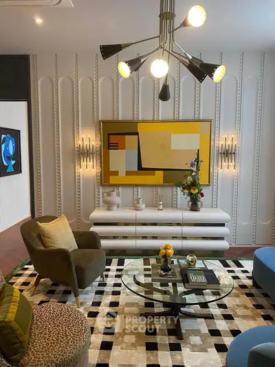Stylish living room with modern decor, featuring unique lighting and abstract art, perfect for contemporary living.