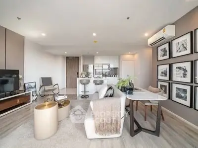 Modern living room with open kitchen and stylish decor
