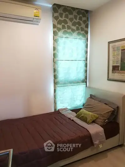 Cozy bedroom with single bed and modern decor