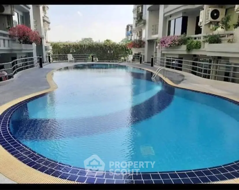 Luxurious residential pool area with modern design and serene ambiance.