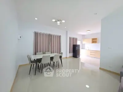 Spacious modern living room with dining area and open kitchen layout