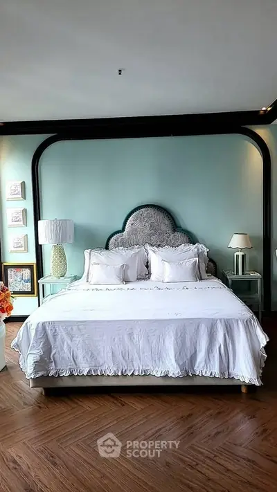 Luxurious bedroom with elegant decor and plush bedding in a stylish real estate property.