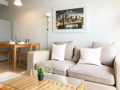 Modern living room with cozy sofa and stylish decor in a bright apartment.