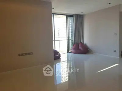 Spacious modern living room with large windows and city view