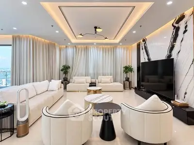 Luxurious modern living room with elegant decor and large TV