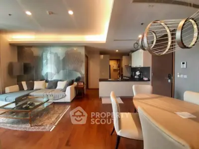 Luxurious open-plan living room with modern decor and elegant dining area