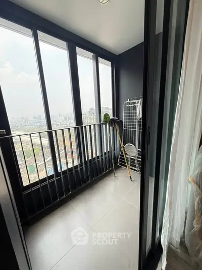 Modern balcony with stunning city view, perfect for relaxation and enjoying the skyline.