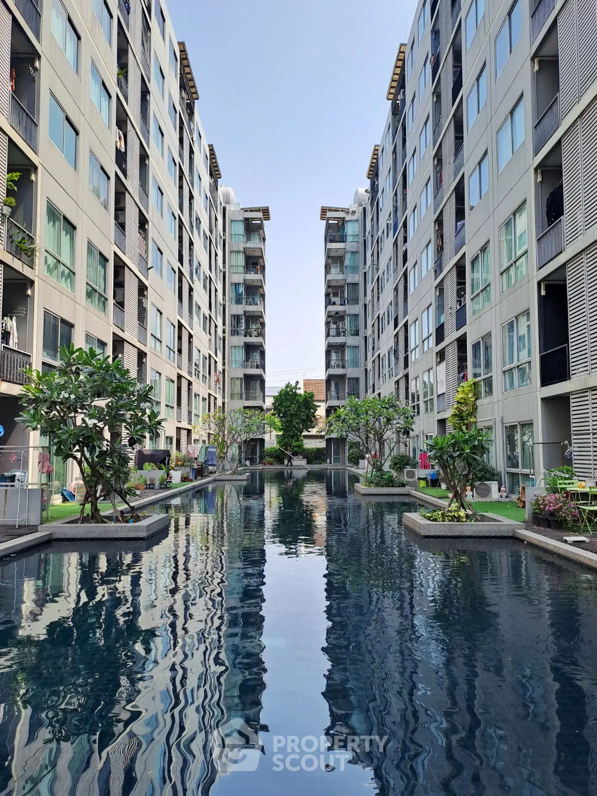 Luxurious apartment complex with stunning pool and modern architecture