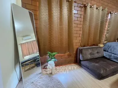 Cozy living room with modern decor and large mirror