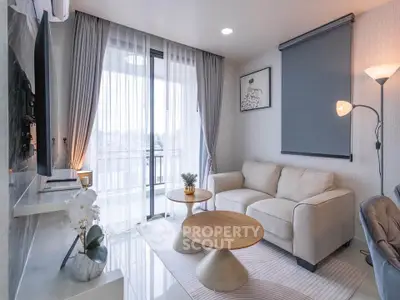 Modern living room with elegant decor and balcony view