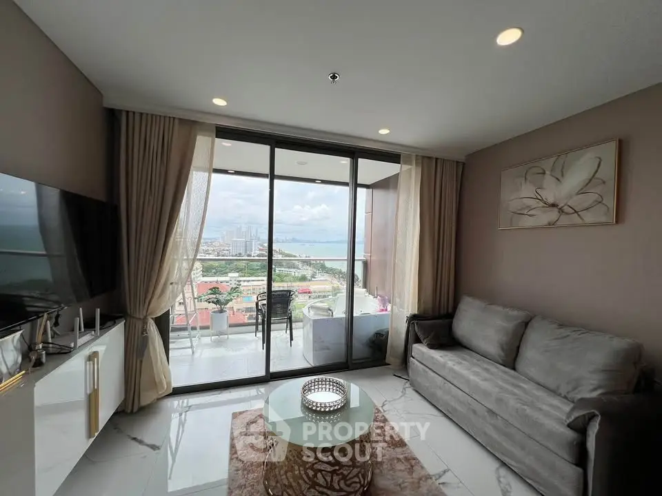 Luxurious living room with stunning city view and spacious balcony access