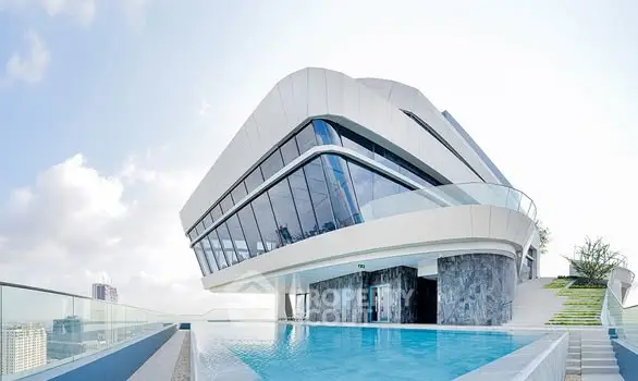 Stunning modern building with rooftop pool and panoramic city views.