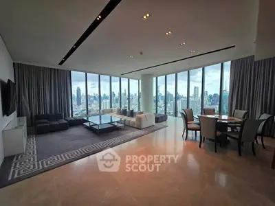 Luxurious high-rise living room with panoramic city views and elegant furnishings.