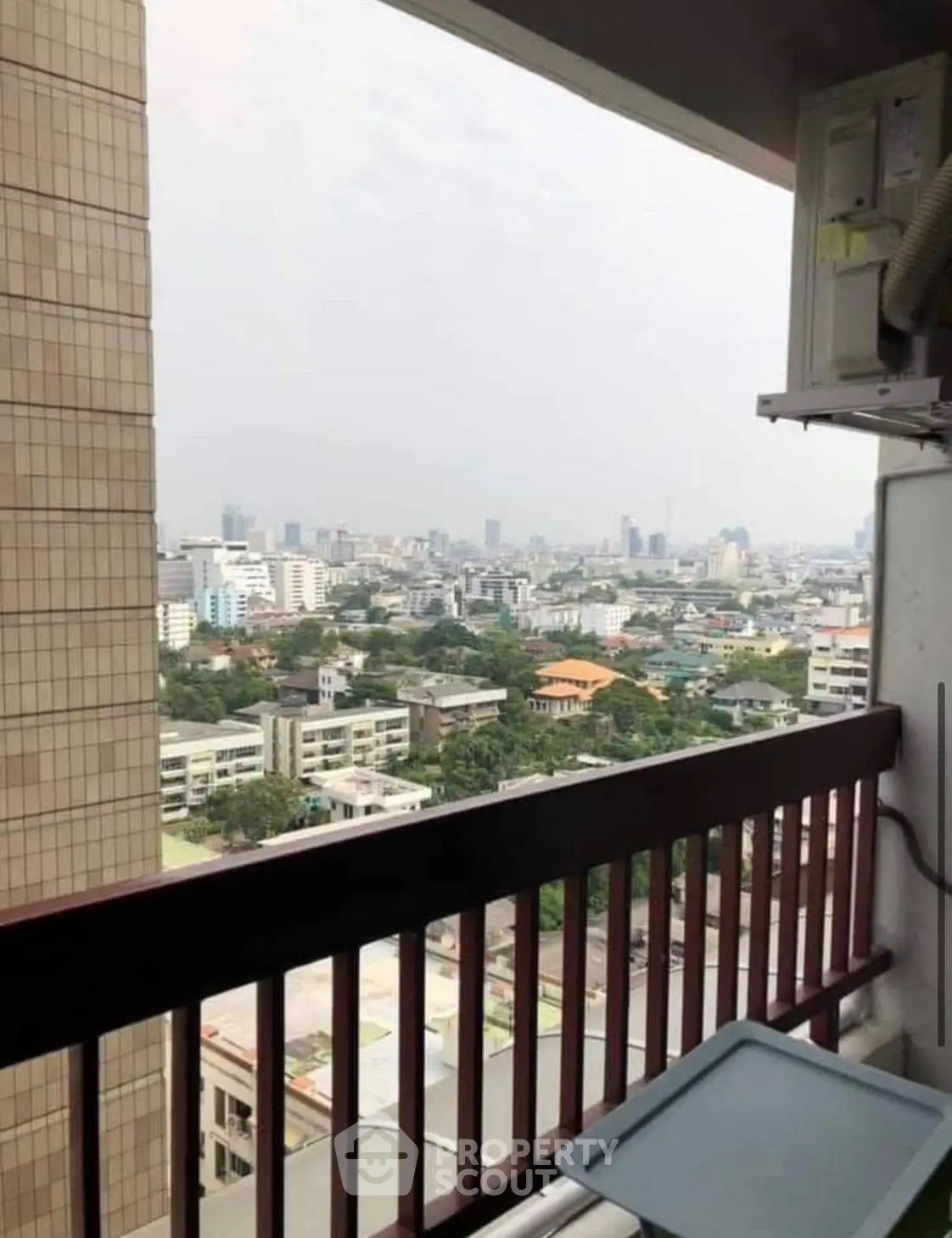 Stunning cityscape view from a high-rise balcony, perfect for urban living enthusiasts.