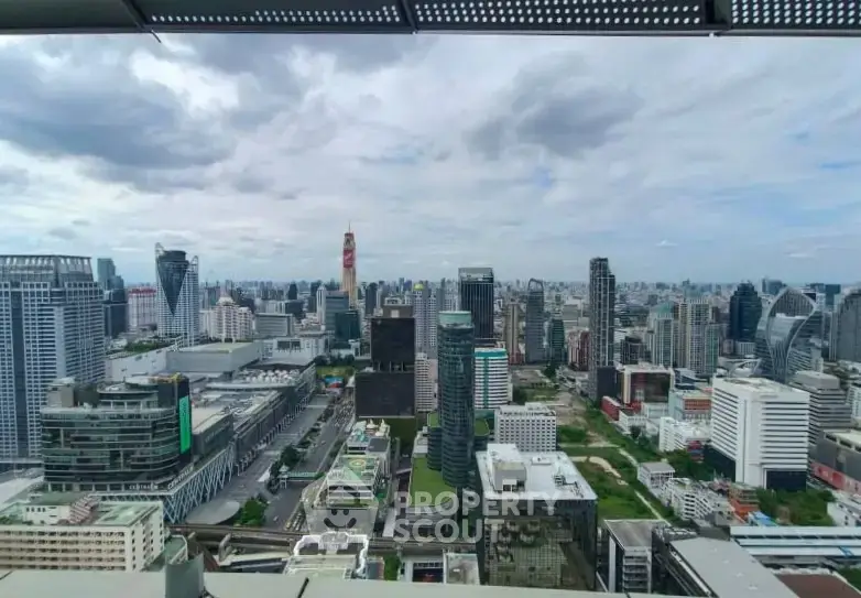 Stunning cityscape view from a high-rise building showcasing modern urban architecture and skyline.