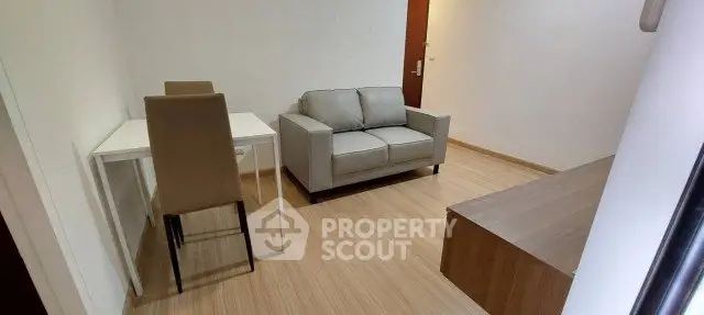 Modern living room with sleek furniture and wooden flooring