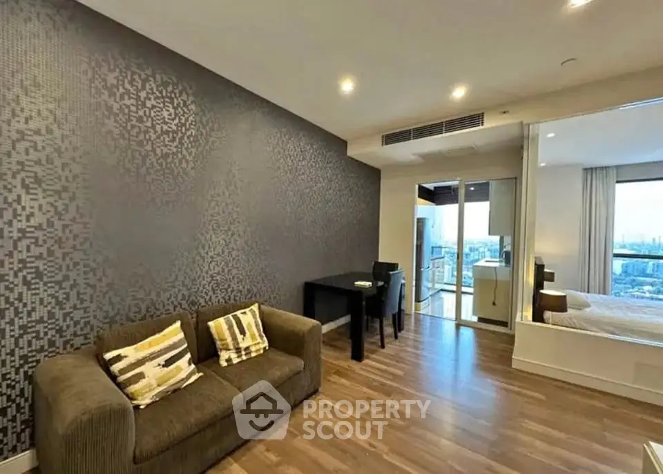 Modern open-plan living room with stylish decor and balcony view