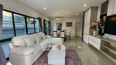 Spacious modern living room with elegant decor and large windows