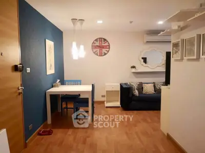 Charming living room with modern decor and cozy seating area, perfect for relaxation and entertaining.