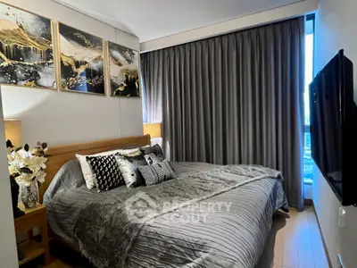 Luxurious bedroom with elegant decor and large window view