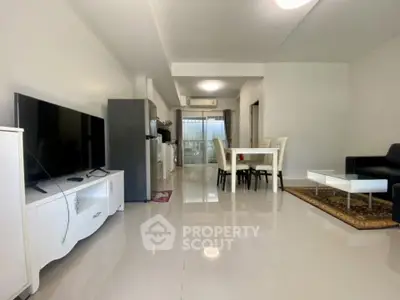 Spacious modern living room with open layout and sleek furnishings