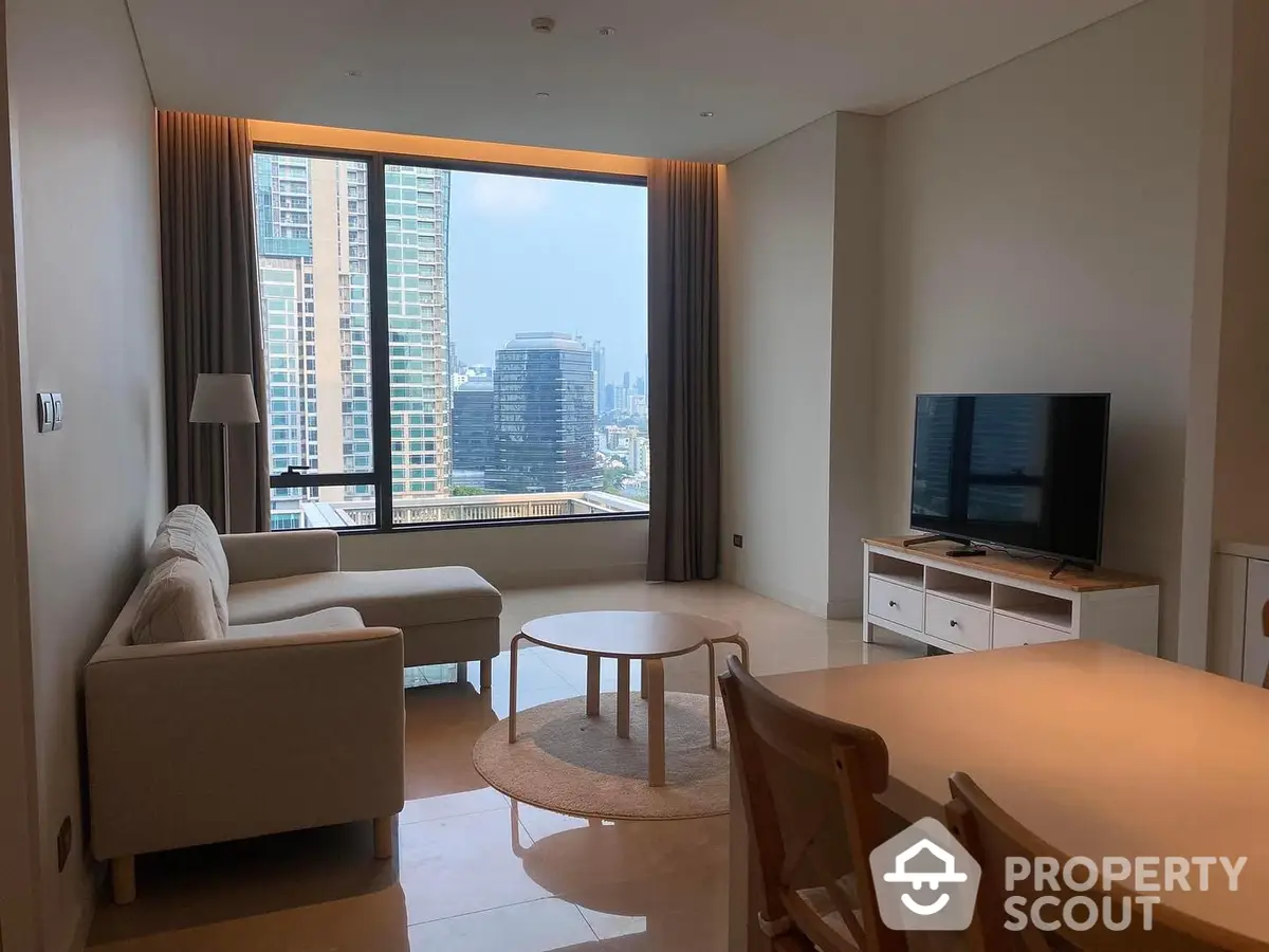 Elegant living room with ample natural light, modern furniture, and a breathtaking city view through large windows, perfect for urban living.