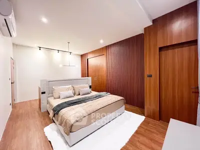 Luxurious modern bedroom with elegant wood paneling and ambient lighting