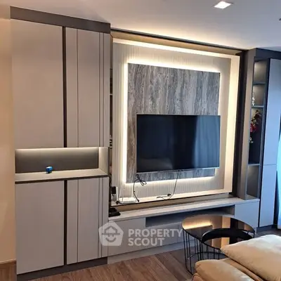 Modern living room with sleek built-in TV unit and ambient lighting